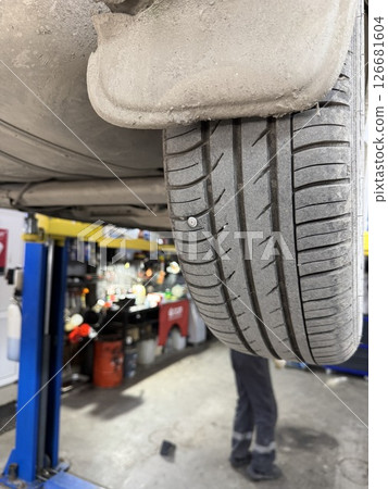 Close-up of a screw in a car wheel.  126681604