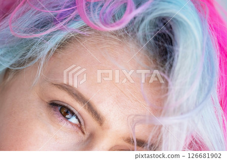 Close-up portrait of Caucasian woman with multi-colored hairstyle.  126681902