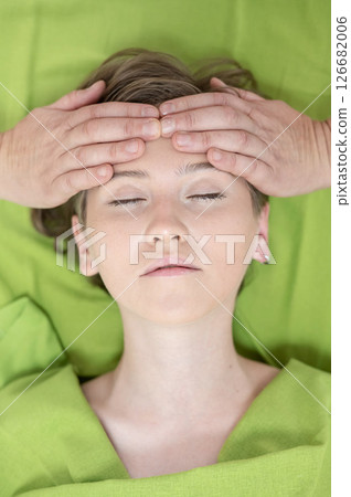 Top view of woman getting facial massage. Top view of woman getting facial massage. 126682006