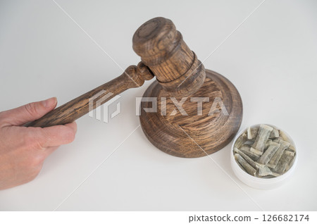 Judge Bangs Gavel. Chewing Tobacco Ban.  126682174