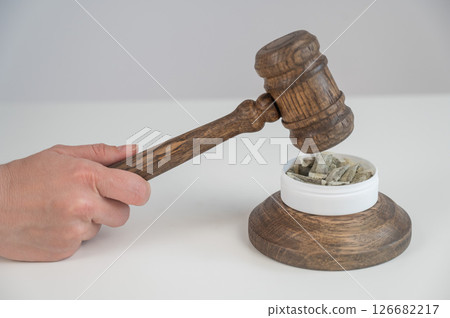 Judge Bangs Gavel. Chewing Tobacco Ban.  126682217