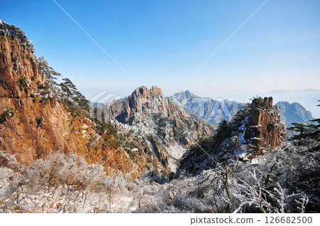Mountain landscape after heavy snowfall, trees covered with snow and rime, China, Anhui Province, Mount Huang Mountain landscape after heavy snowfall, trees covered with snow and rime, China, Anhui Province, Mount Huang 126682500