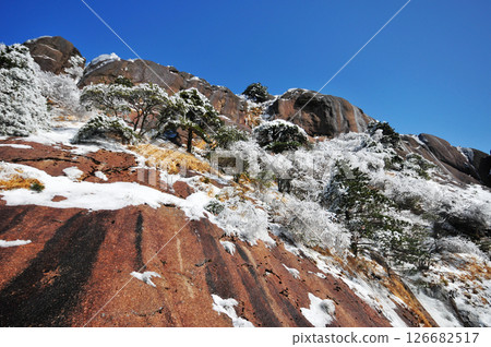 Mountain landscape after heavy snowfall, trees covered with snow and rime, China, Anhui Province, Mount Huang Mountain landscape after heavy snowfall, trees covered with snow and rime, China, Anhui Province, Mount Huang 126682517