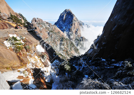 Mountain landscape after heavy snowfall, trees covered with snow and rime, sea of fluffy misty clouds ,China, Anhui Province, Mount Huang 126682524
