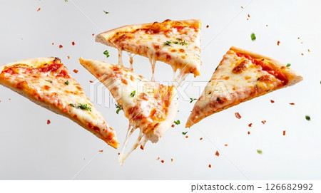 Four appetizing pizza slices with melted cheese and spices are levitating on a white background, creating a dynamic and tempting culinary scene 126682992