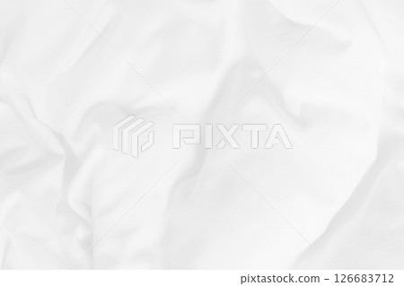 Close up top view of white bedding sheet and wrinkle messy blanket in bedroom after wake up in the morning. 126683712