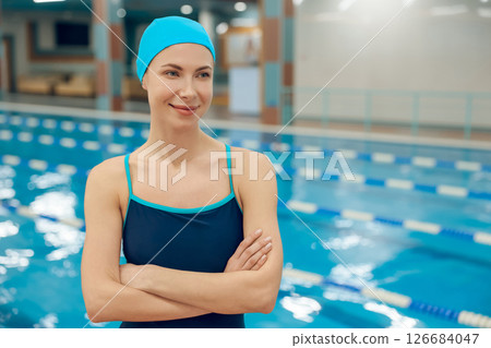 Pretty caucasian young woman in swimming cap and swimsuit 126684047