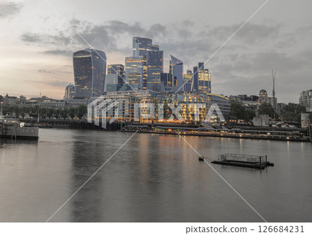 The Stunning view of The Skyscrapers of Financial District with River Thames after sunset in City of London. 126684231