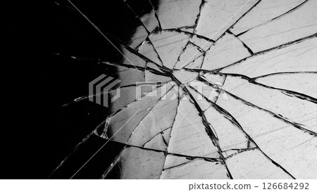 Processed collage of broken glass surface texture.  126684292