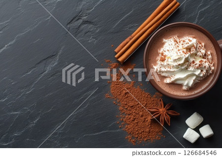 Hot chocolate with whipped cream and marshmallows on a dark slate background Hot chocolate with whipped cream and marshmallows on a dark slate background 126684546