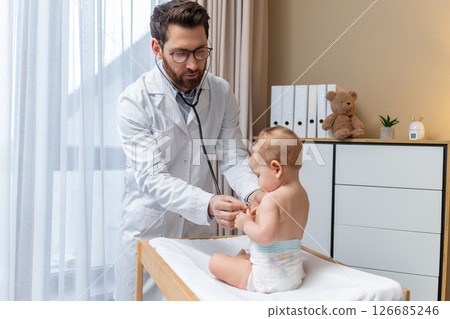 Cute little baby boy having an exam at the doctors office 126685246