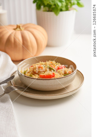 Healthy quinoa bowl with vegetables and pumpkin. 126685874