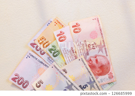 Turkish lira currency denominations mixed are neatly arranged, showcasing their vibrant designs 126685999