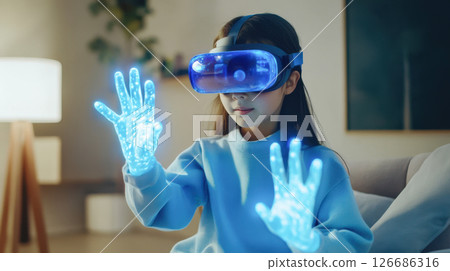 A young girl explores virtual reality, technology innovation immersive experience with blue digital effects, and digital worlds. 126686316