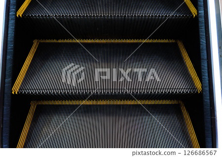 Close-up of escalator steps showing intricate design and structure. High quality photo 126686567