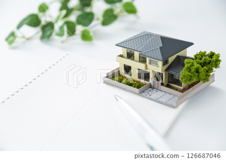 House model, calculator and notebook 126687046