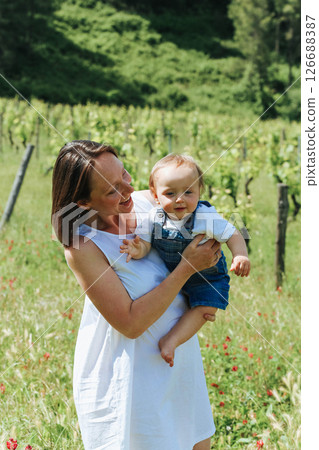 Joyful Mother and Child in Vineyard Joyful Mother and Child in Vineyard 126688387