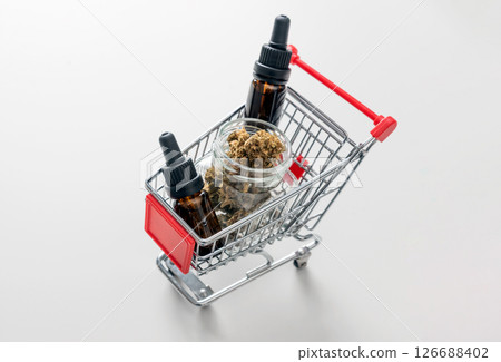 Medical CBD herb and oil in shopping cart 126688402