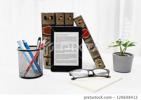 E-book reader device in home library E-book reader device in home library 126688412