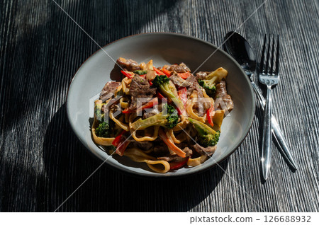 Pasta with beef, mushrooms and vegetables. Pasta with beef, mushrooms and vegetables. 126688932