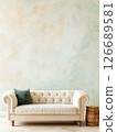 White sofa against vintage green and beige wall. 126689581
