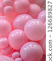 Close-up of Glossy Pink Balloons Creating a Soft and Bubbly Abstract Background for Celebration Designs Close-up of Glossy Pink Balloons Creating a Soft and Bubbly Abstract Background for Celebration Designs 126689827