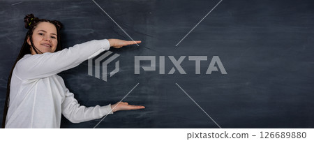 A Woman is Presenting on a Chalkboard Background Designed for Various Educational Content A Woman is Presenting on a Chalkboard Background Designed for Various Educational Content 126689880