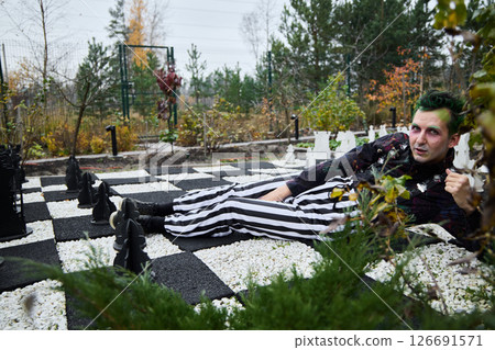 A Creative Chess Themed Photoshoot Taking Place in the Beautiful Outdoors of Nature 126691571