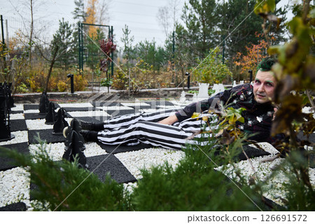 A unique and captivating chess themed fashion shoot set in a beautiful autumn environment A unique and captivating chess themed fashion shoot set in a beautiful autumn environment 126691572