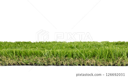 Side profile of artificial green grass turf section isolated on a clean white background. Side profile of artificial green grass turf section isolated on a clean white background. 126692031