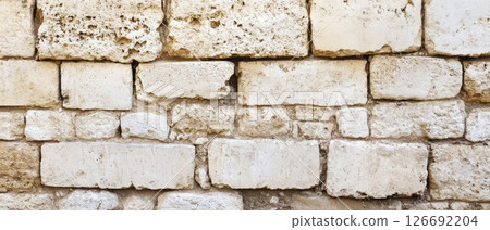 Old weathered stone wall with texture and detail Old weathered stone wall with texture and detail 126692204