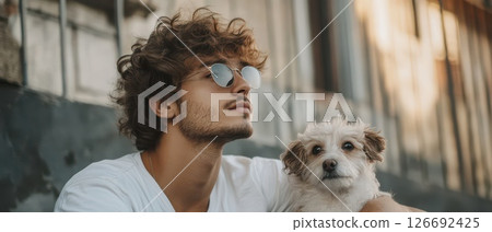 Man enjoys time with dog in urban setting 126692425