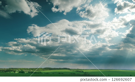 A Serene Sky Over Lush Green Fields Creates A Beautiful Tranquil Landscape That Inspires Time lapse. A Serene Sky Over Lush Green Fields Creates A Beautiful Tranquil Landscape That Inspires Time lapse. 126692607