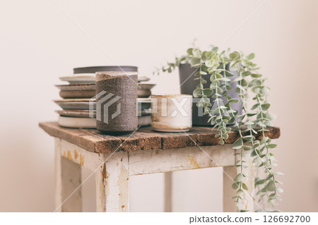 Old chair with ceramic dishes Old chair with ceramic dishes 126692700