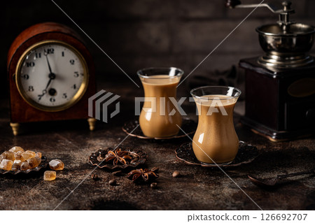 Tea or Coffee with milk and spices 126692707