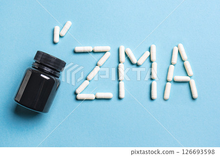 ZMA supplement capsules and bottle 126693598