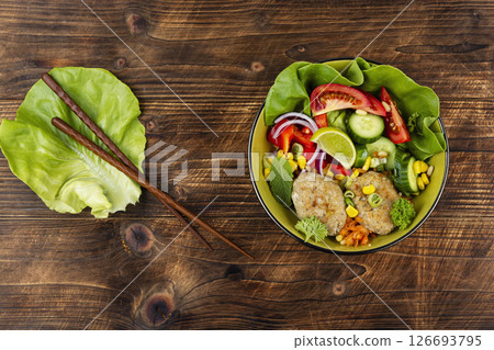 Vegetable Buddha Bowls with Fish cutlets. 126693795