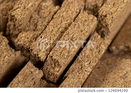 cork wood, which is used in industry and household needs, the bark of a cork tree, broken cork wood panel cork wood, which is used in industry and household needs, the bark of a cork tree, broken cork wood panel 126694200