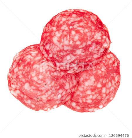 Slices of salami sausages isolated on a white background Slices of salami sausages isolated on a white background 126694476