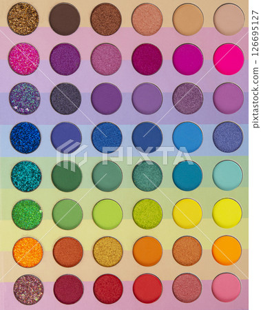 Multicolored neon eyeshadow palette. Make-up. Beauty products. Bright colorful beautiful background. Tool for makeup artist. Cosmetic. Visagiste. Beauty shop. Summer eye shadow. 126695127