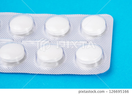 Pills in blister on blue background with space for text Pills in blister on blue background with space for text 126695166