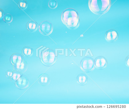 Soap bubbles on blue background blured selective Soap bubbles on blue background blured selective 126695280