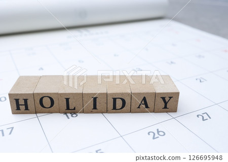 The word HOLIDAY on the calendar The word HOLIDAY on the calendar 126695948