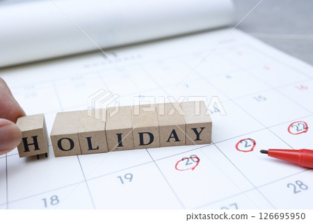 The word HOLIDAY on the calendar 126695950