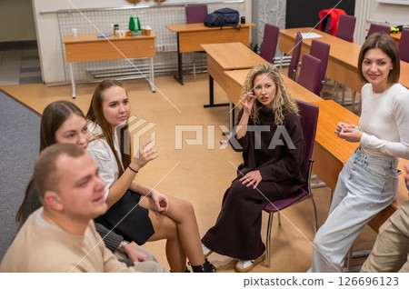 Hearing impaired students communicate during breaks at the university. Hearing impaired students communicate during breaks at the university. 126696123