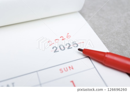 Cross out the 2025 on the calendar and change it to 2026 in red pen 126696260