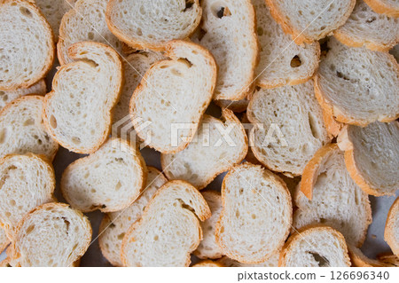 Sliced french baguette overhead view. Bread texture and pattern 126696340