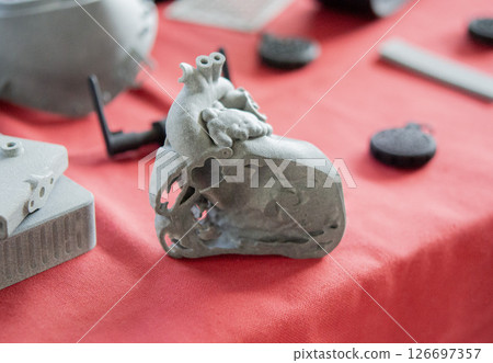 A prototype of a human heart in section printed on a 3D printer. An object created on a 3D printer from sintered plastic powder. New modern additive technologies. 3D Printing technology A prototype of a human heart in section printed on a 3D printer. An object created on a 3D printer from sintered plastic powder. New modern additive technologies. 3D Printing technology 126697357