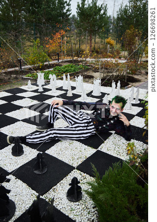 A Stunning Chessthemed Fashion Shoot Set in a Beautiful and Serene Garden Environment A Stunning Chessthemed Fashion Shoot Set in a Beautiful and Serene Garden Environment 126698261