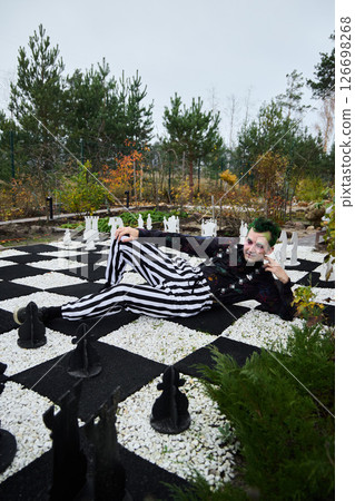 Fashion is showcased beautifully on a unique and intriguing chessboard landscape setting 126698268